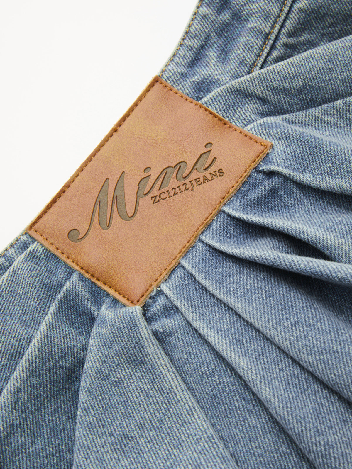 Asymmetric Pleated Denim Mini Skirt